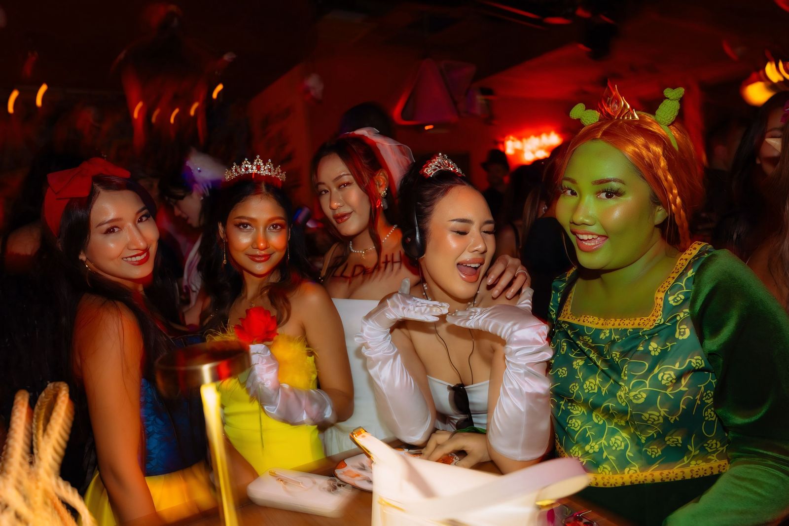 Guests dressed as Disney princesses at the Halloween Crawl