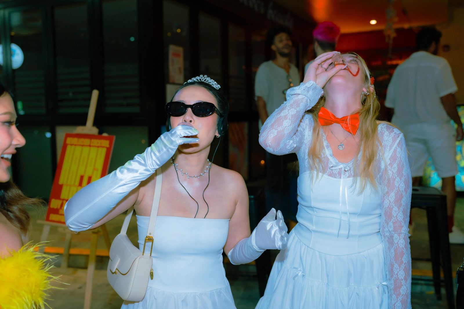 Two friends taking a shot together at the Halloween Crawl