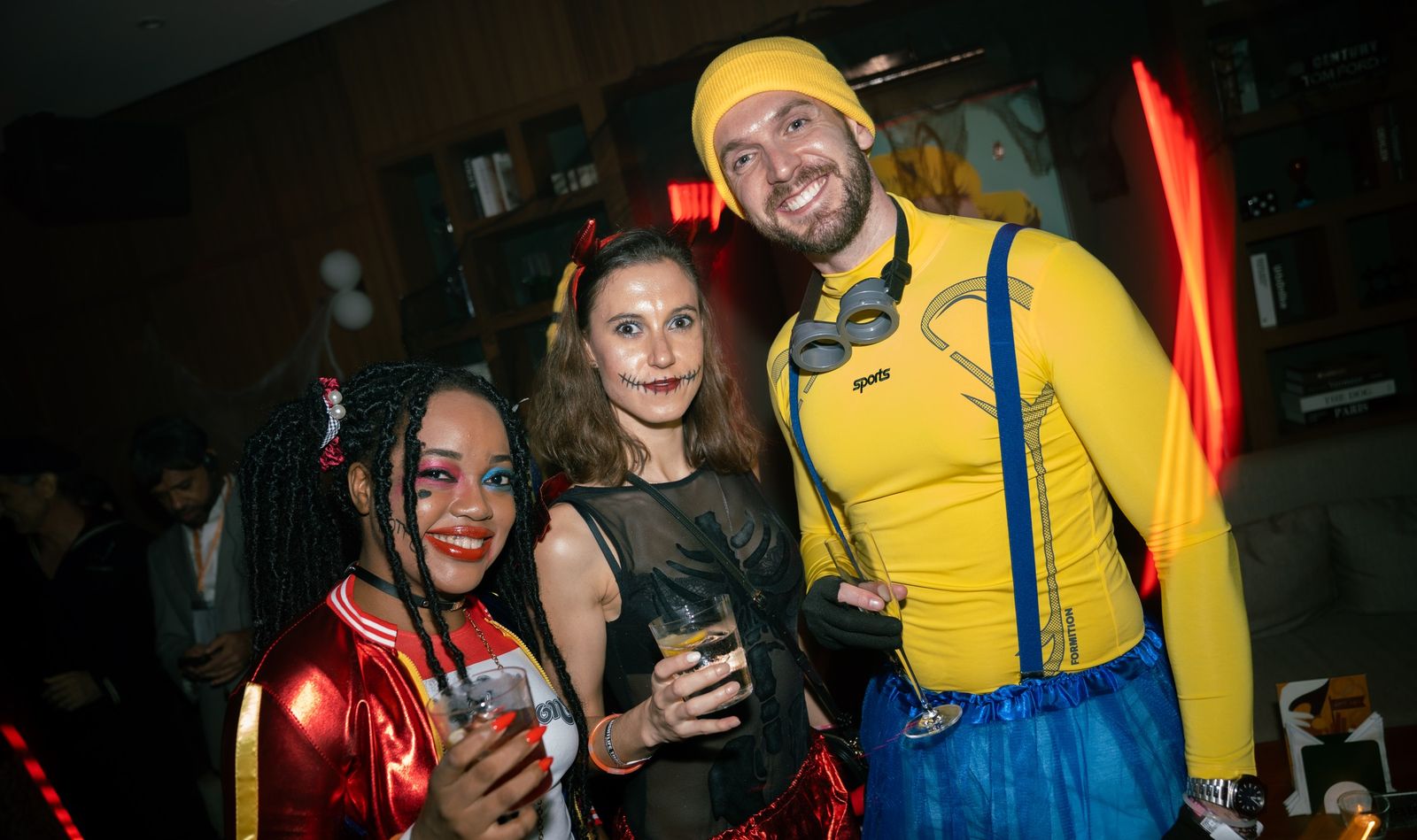 A trio of friends in Halloween costumes