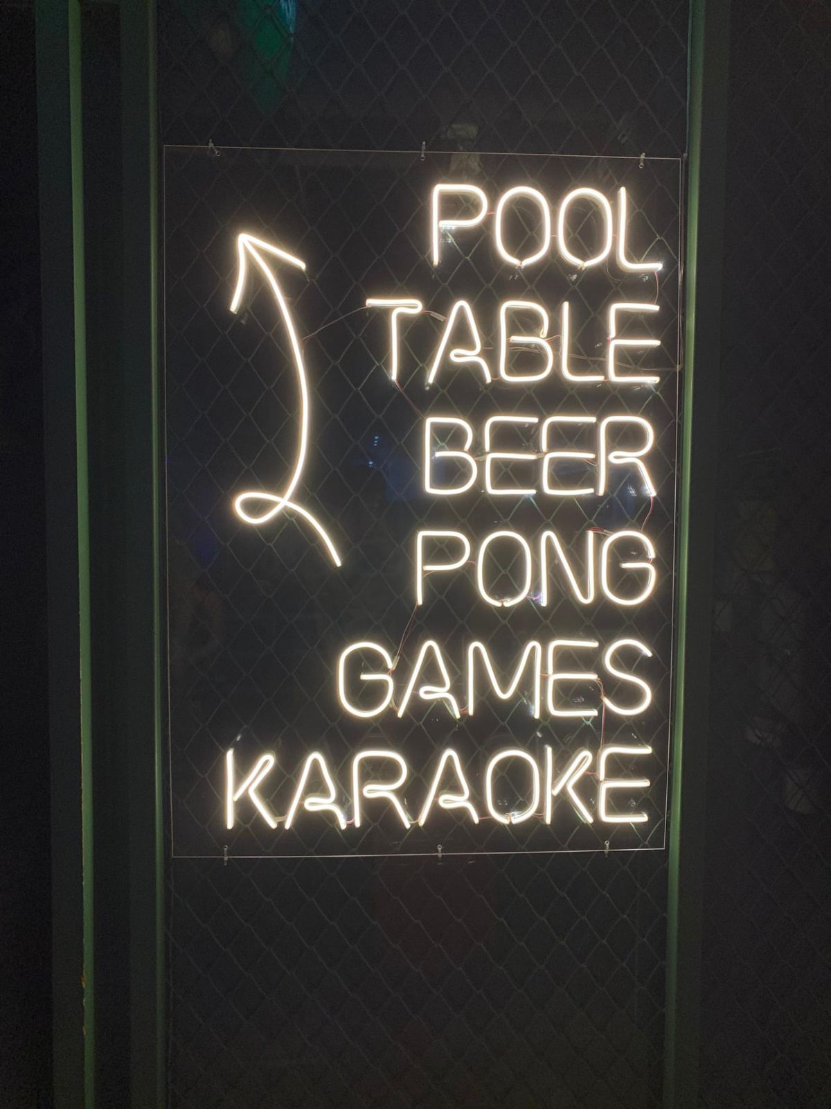 Neon sign: pool table, beer pong, games, karaoke